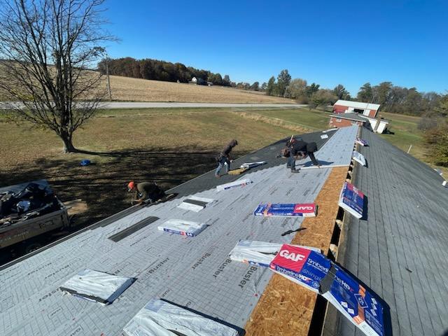 New shingles are still in bags and spaced out across the roof. The new roof will be installed by Guarantee Roofing and Fence in Terre Haute Indiana.